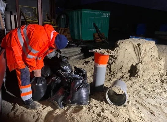 wateroverlast_loods_zandzakjes_opwijk.jpg