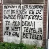 Graffiti die de burgemeester van Meise en de politie bedreigen