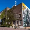 De stalen cyclist, street art op de gevel van Brouwerij Palm